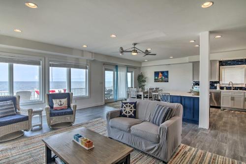 a living room with a couch and a table at Waterfront Sanctuary with Panoramic Bay Views! in Pierces Point