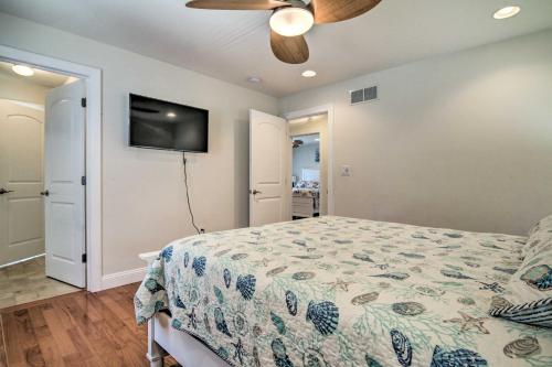 a bedroom with a bed and a ceiling fan at Waterfront Sanctuary with Panoramic Bay Views! in Pierces Point
