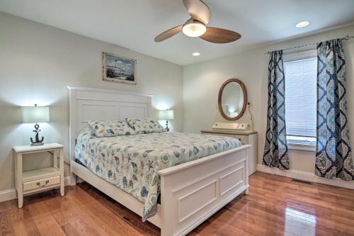 a bedroom with a bed and a ceiling fan at Waterfront Sanctuary with Panoramic Bay Views! in Pierces Point