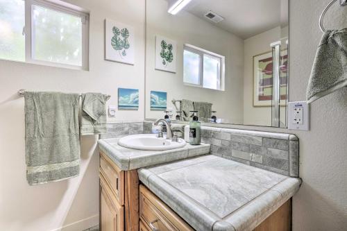a bathroom with a sink and a mirror at Peaceful Petaluma Getaway with Deck and Grill! in Petaluma