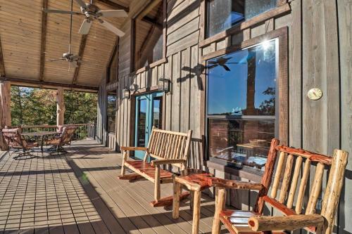 a porch with benches and windows on a house at Mountain View Hideaway with Outdoor Fireplace! in Mountain View