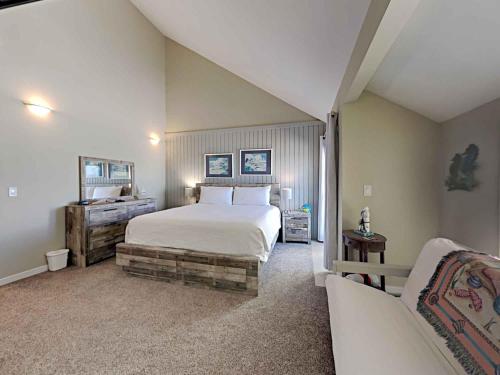 a bedroom with a large bed and a couch at Solana Shores #5 in Perdido Key