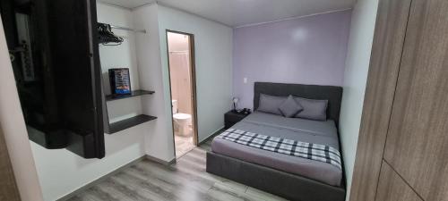 Postel nebo postele na pokoji v ubytování Stay Blue Hotel