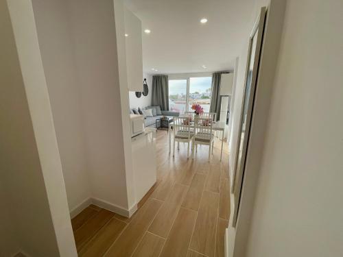 a view of a living room and dining room at Malibu Park 2115 - Ocean View in Adeje