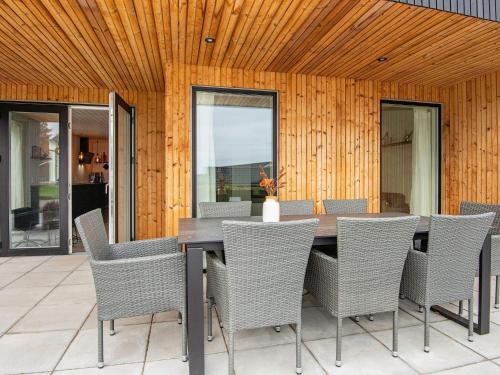 a dining room with a table and chairs at Luxury Seaside Retreat - By Traum Ferienwohnungen in Haderslev