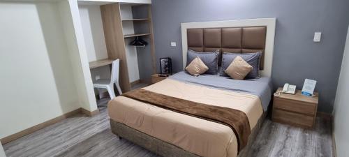 Postel nebo postele na pokoji v ubytování Blue House Corferias