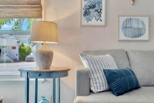 a lamp on a table next to a couch at Rosé Getaway Close to Downtown Paso Robles 2 Bed/1 Bath in Paso Robles