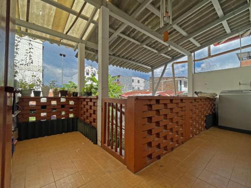 a room with a balcony with a fence and windows at Casa Madre Tierra SRC in Santa Rosa de Cabal