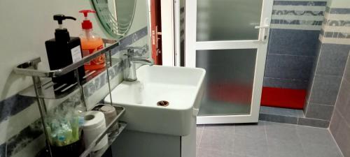 a bathroom with a sink and a mirror at Song Toan Hotel in Phong Nha