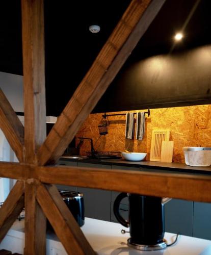 a kitchen with a counter with a counter top at Inn Door 21 - Hostel & Suite in Bragança