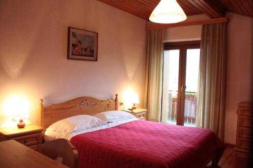 Un pat sau paturi într-o cameră la Hotel Galeno