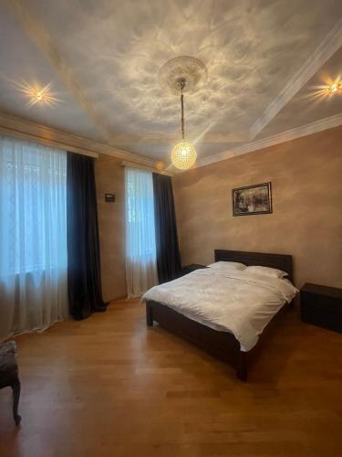 Llit o llits en una habitació de Natali Apartment