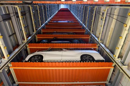 a white car on a conveyor belt at The Granite Luxury Hotel Penang in George Town