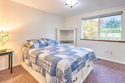 a bedroom with a bed and a window at Walkable Sitka Getaway with Community Perks! in Sitka