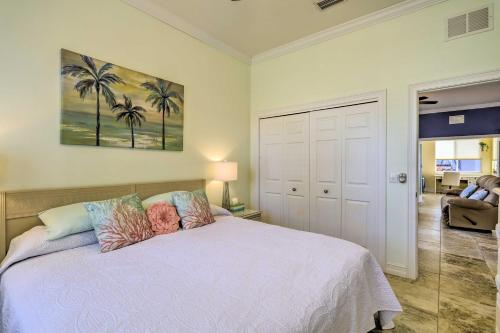 a bedroom with a bed with palm trees on it at The Shell House with Pool and Golf Access! in Titusville