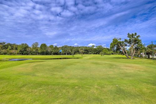 a golf course with a green field and trees at The Shell House in Titusville Pool, Golf Access in Titusville