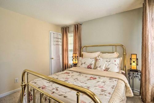 a bedroom with a bed and two lamps and a window at 9 Mi to Richmond Sandston Home with Office in Sandston