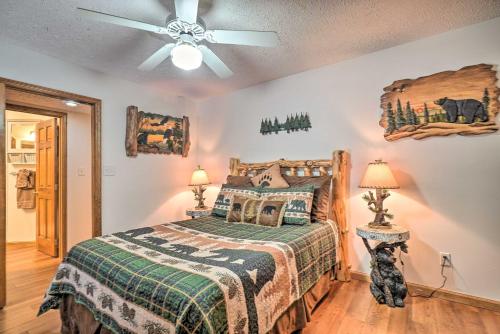 a bedroom with a bed and a ceiling fan at Picturesque Pigeon Forge Cabin with Mountain Views in Pigeon Forge