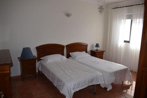 a bedroom with two beds and a window at Saint Julians Seafront 200m2 beautiful Apartment in Tal-Għoqod