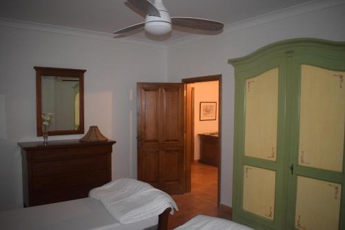 a bedroom with a bed and a ceiling fan at Saint Julians Seafront 200m2 beautiful Apartment in Tal-Għoqod