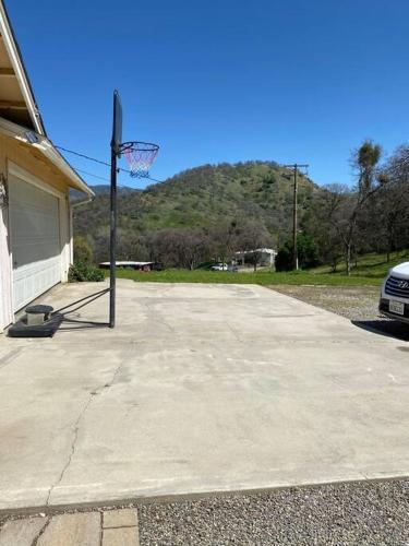 a basketball hoop in front of a house at Waxberry Getaway Sequoia/Kings Canyon National Pks in Squaw Valley
