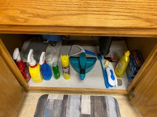 a drawer with cleaning utensils in a cabinet at Waxberry Getaway Sequoia/Kings Canyon National Pks in Squaw Valley