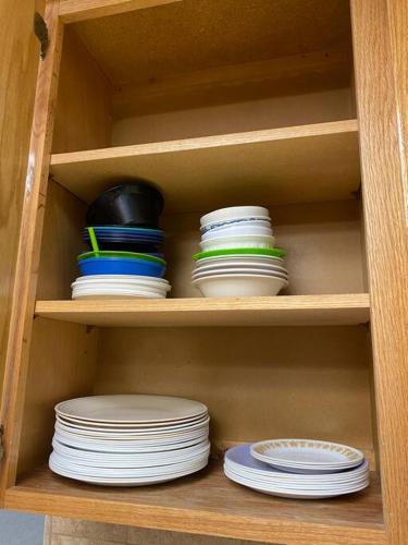 a wooden cabinet with plates and bowls and plates on it at Waxberry Getaway Sequoia/Kings Canyon National Pks in Squaw Valley