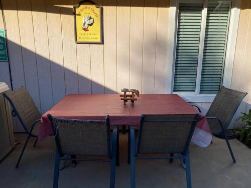 a wooden table with chairs on a patio at Waxberry Getaway Sequoia/Kings Canyon National Pks in Squaw Valley