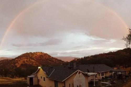 a rainbow in the sky over a house at Waxberry Getaway Sequoia/Kings Canyon National Pks in Squaw Valley
