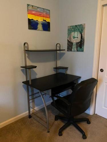 a black desk and a chair in a room at Waxberry Getaway Sequoia/Kings Canyon National Pks in Squaw Valley
