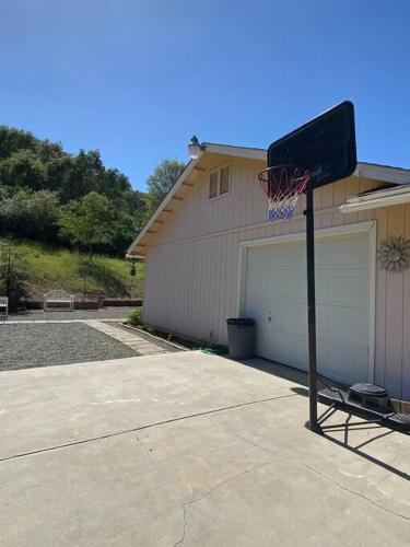 a basketball hoop in front of a garage at Waxberry Getaway Sequoia/Kings Canyon National Pks in Squaw Valley