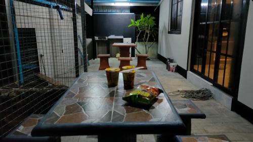 a table with some food on top of it at Aleesa Roomstay & Hotel in Pasir Puteh