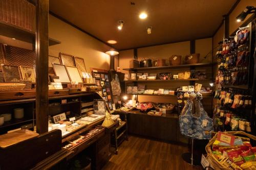 a store with a counter in a room with at Mount View Hakone in Hakone