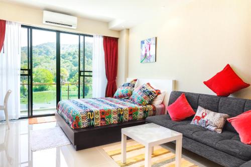 a living room with a couch and a table at The Nai Thon Condominium Unit in Nai Thon Beach