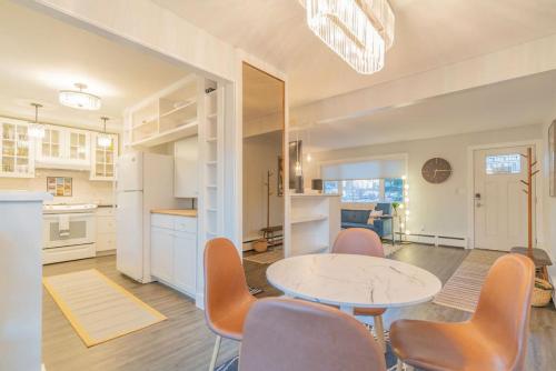 a kitchen and dining room with a table and chairs at Taku's Contemporary & Stylish Private Retreat in Fairbanks