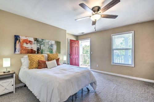a bedroom with a bed and a ceiling fan at Lovely East Point Home Less Than 8 Mi to Downtown ATL in Atlanta