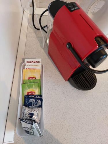 a red suitcase sitting on top of a counter at Casina 2 quadrati, vista collina in Moncalieri