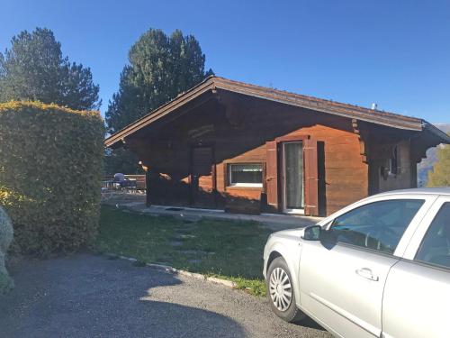 a car parked in front of a house at Les Tchaipus in Nendaz
