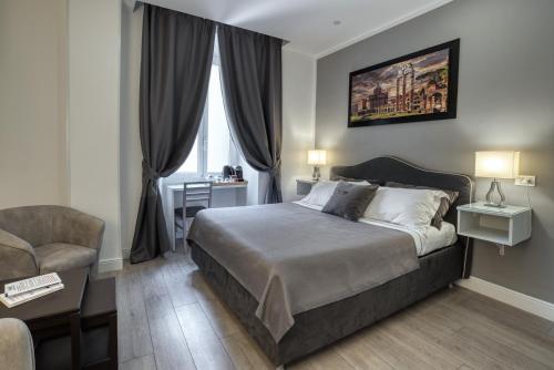 A bed or beds in a room at Rhome Guest House