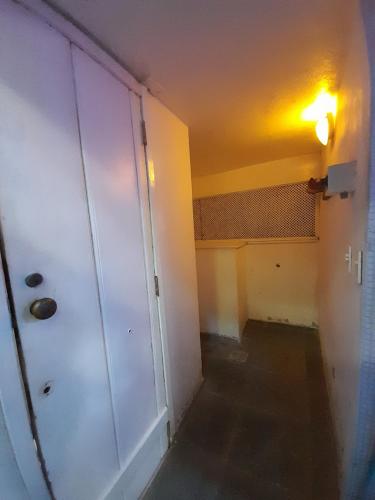 an empty room with a door and a hallway at Casa Solar in Rio de Janeiro