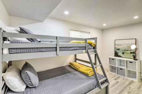 a bedroom with three bunk beds in a room at West Valley City Duplex about 13 Mi to Downtown SLC! in West Valley City