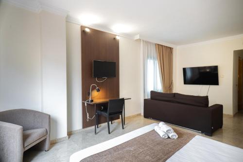 a living room with a couch and a desk at Mainake Costa del Sol in Torre del Mar