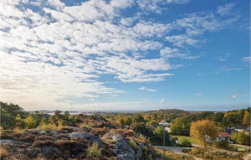 a view from a hill with a blue sky and clouds at 3 Bedroom Stunning Home In Kyrkesund in Kyrkesund