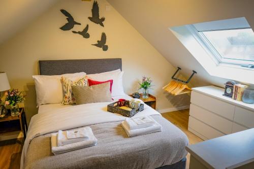 a bedroom with a bed with bats on the wall at Ditton Fields by condokeeper in Chesterton