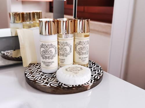 a group of three products sitting on a table at Chalet Vitorino in Sintra