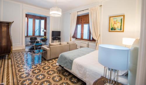 a bedroom with a bed and a living room at Chalet Vitorino in Sintra