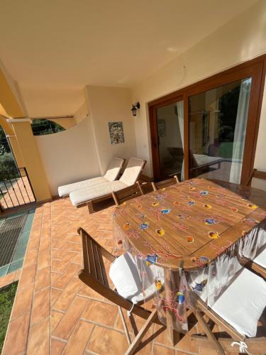 a room with a table and chairs and a patio at La Marea in Chia