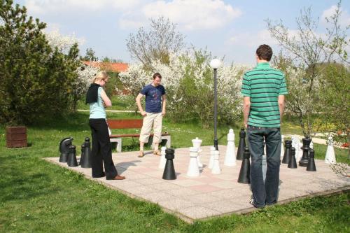 a group of people playing a game of chess at Ferienpark Lauterdörfle 9 in Hayingen