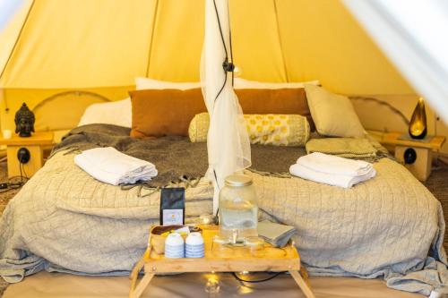 a bedroom with a bed in a tent at Surfviken in Stenungsund