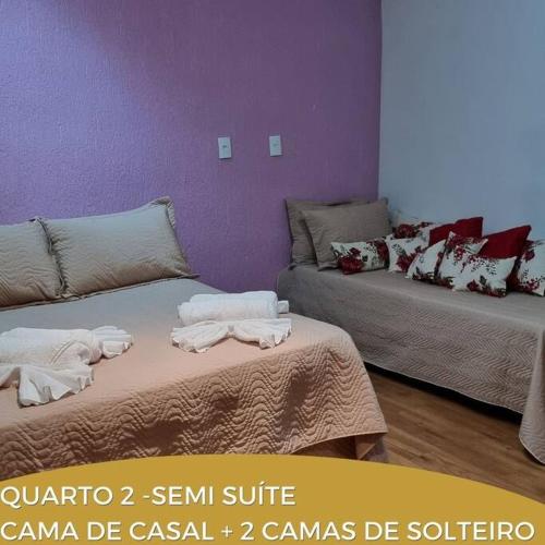 Katil atau katil-katil dalam bilik di Dara House e eventos com piscina aquecida, sauna, Jacuzzi e área gourmet para festas de até 200 pessoas